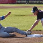 Andrew Lamb of the Anchorage Glacier Pilots slides under the tag of Peninsula Oilers third baseman Michael Elko for a triple Saturday, July 22, 2023, at Coral Seymour Memorial Park in Kenai, Alaska. (Photo by Jeff Helminiak/Peninsula Clarion)