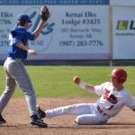 Brett Grupe of the Peninsula Oilers slides under the tag of Anchorage Glacier Pilots shortstop Joey Wright to steal second base Sunday, July 23, 2023, at Coral Seymour Memorial Park in Kenai, Alaska. (Photo by Jeff Helminiak/Peninsula Clarion)