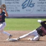 Michael Elko of the Peninsula Oilers beats a throw to Chugiak-Eagle River Chinooks second baseman Kevin Duran on Sunday, July 30, 2023, at Coral Seymour Memorial Park in Kenai, Alaska. (Photo by Jeff Helminiak/Peninsula Clarion)