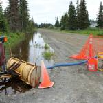 A canal full of water terminates on Eastway R. on Friday, July 21, 2023 near Kenai, Alaska. (Ashlyn OHara/Peninsula Clarion)