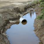 A newly-installed culvert moves water at the intersection of Patrick Dr. and Bjerke St. on Monday, July 24, 2023 near Kenai, Alaska. (Ashlyn OHara/Peninsula Clarion)