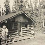 Amanda Walker, of Kenai, poses in front of her friend Mable Smiths homestead cabin off Kalifornsky Beach Road, circa 1961. (photo courtesy of the Smith Family Collection)