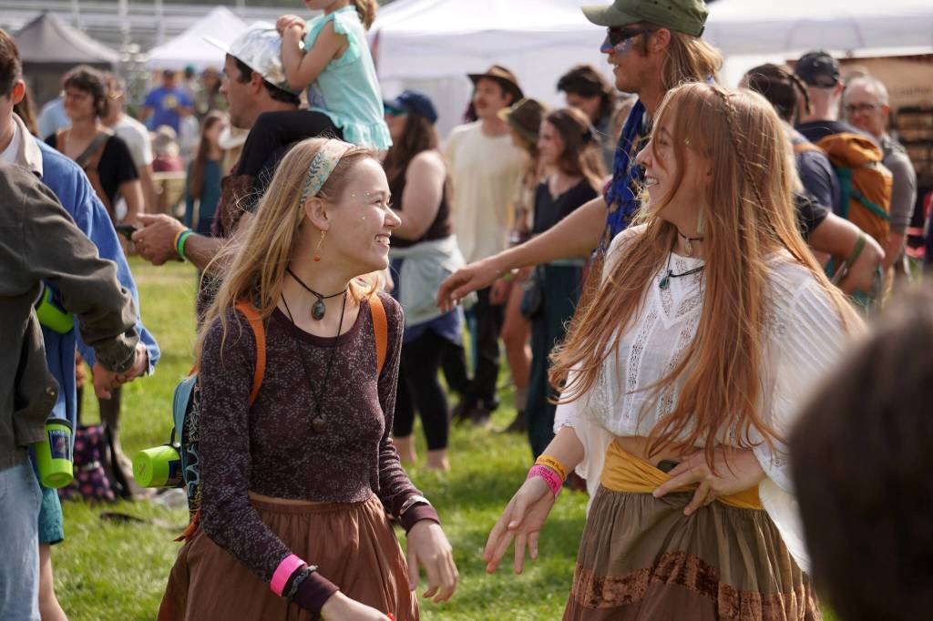 Attendees dance along to a performance by Discopians on the Ocean Stage at Salmonfest in Ninilchik, Alaska, on Friday, Aug. 4, 2023. (Jake Dye/Peninsula Clarion)