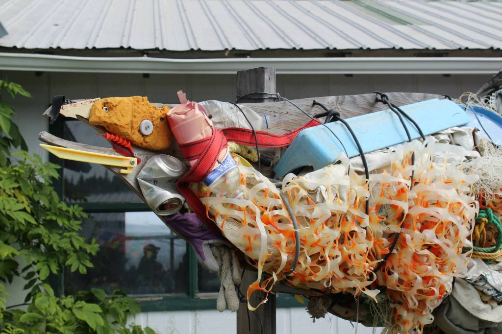 A salmon made out of trash is displayed at Salmonfest on Friday, Aug. 4, 2023 in Ninilchik, Alaska. (Ashlyn OHara/Peninsula Clarion)