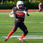 Kenais Cole Langham weighs his options before a drive during a season opening game at Ed Hollier Field in Kenai, Alaska, on Friday, Aug. 11, 2023. (Jake Dye/Peninsula Clarion)