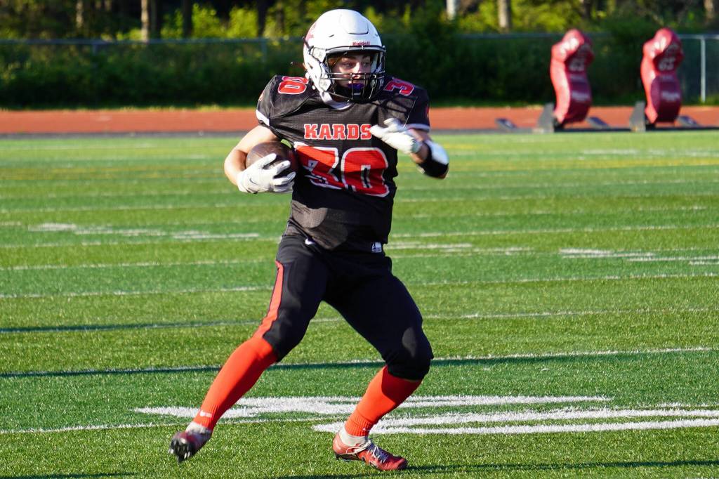 Kenais Cole Langham weighs his options before a drive during a season opening game at Ed Hollier Field in Kenai, Alaska, on Friday, Aug. 11, 2023. (Jake Dye/Peninsula Clarion)