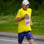 Mark Barbee, first place finisher for the Mens 10K, races towards the finish chute of the 34th Annual Kenai Peninsula Violence Free Community Run in Kenai, Alaska, on Saturday, Aug. 12, 2023. (Jake Dye/Peninsula Clarion)