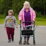 Cindy Todd, right, walks to the finish line of the 34th Annual Kenai Peninsula Violence Free Community Run in Kenai, Alaska, on Saturday, Aug. 12, 2023. (Jake Dye/Peninsula Clarion)