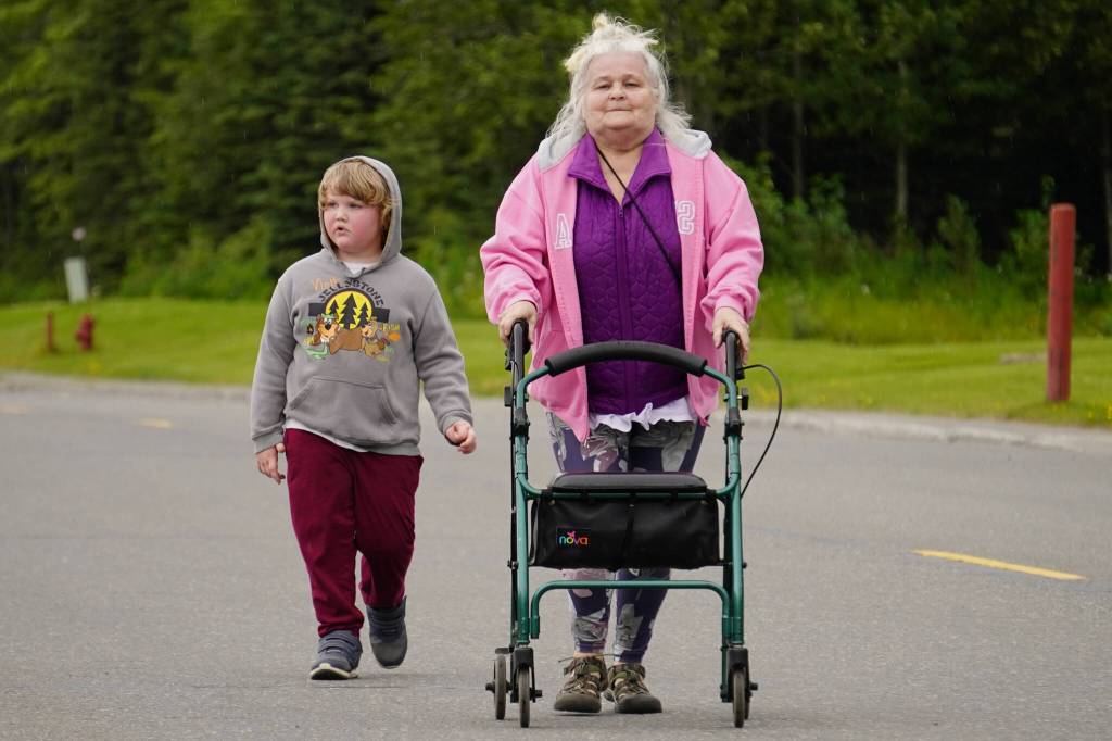 Cindy Todd, right, walks to the finish line of the 34th Annual Kenai Peninsula Violence Free Community Run in Kenai, Alaska, on Saturday, Aug. 12, 2023. (Jake Dye/Peninsula Clarion)