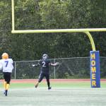 Homers Chris Martishev catches a 58-yard pass from quarterback Preston Stanislaw, scoring a touchdown and bringing the Mariners score up to eight points in the first quarter of the home opener varsity game on Saturday, Aug. 12, 2023 in Homer, Alaska. (Delcenia Cosman/Homer News)