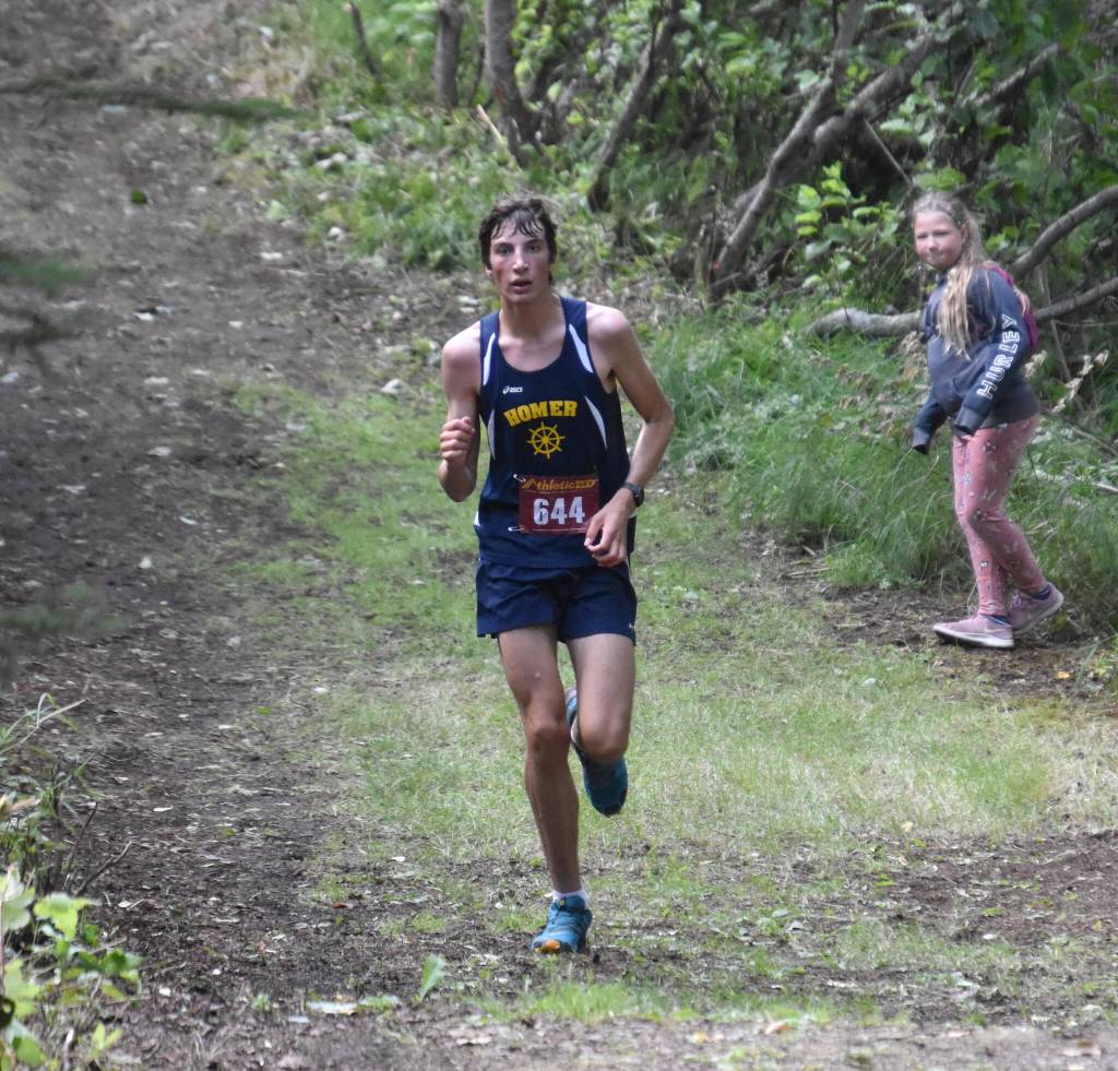 Homer sophomore Johannes Bynagle runs to victory in the freshman-sophomore boys race at the Class Races on Monday, Aug. 14, 2023, at Nikiski High School in Nikiski, Alaska. (Photo by Jeff Helminiak/Peninsula Clarion)