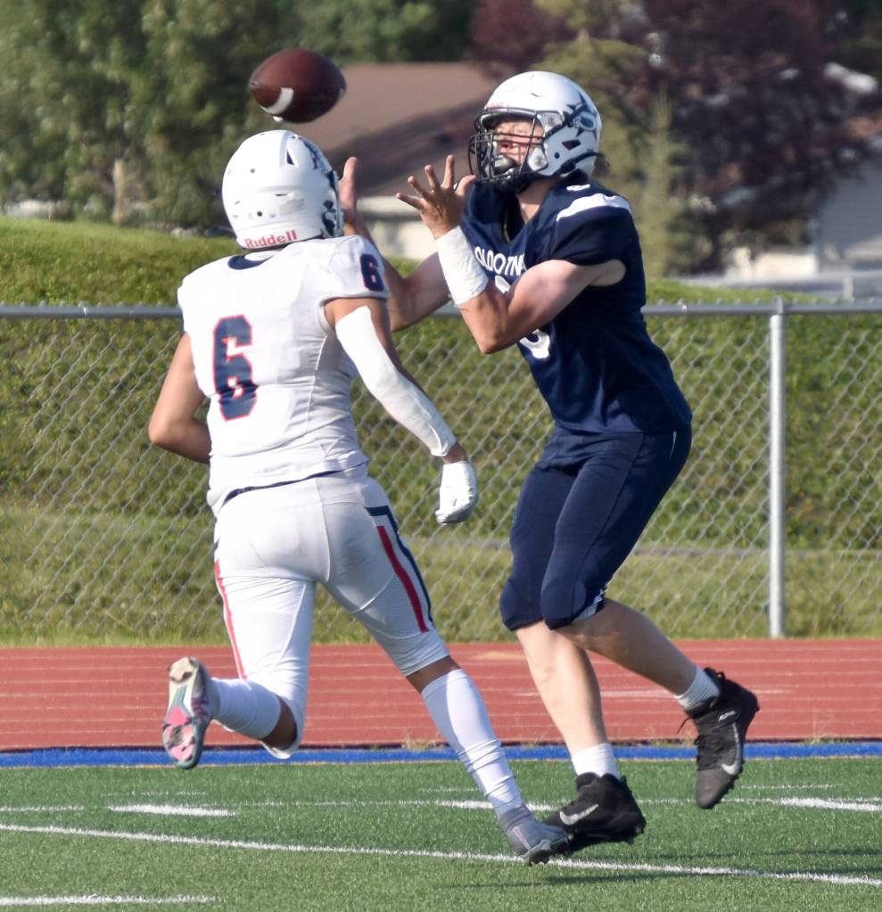 Soldotnas Andrew Pieh catches a pass in front of North Poles Korbin Wallace on Friday, Aug. 18, 2023, at Justin Maile Field at Soldotna High School in Soldotna, Alaska. (Photo by Jeff Helminiak/Peninsula Clarion)