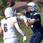 Soldotna's Andrew Pieh catches a pass in front of North Pole's Korbin Wallace on Friday, Aug. 18, 2023, at Justin Maile Field at Soldotna High School in Soldotna, Alaska. (Photo by Jeff Helminiak/Peninsula Clarion)