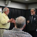 Dave Yragui, left, and Peter Micciche, right, talk about flood problems along Kalifornsky Beach Road during a public meeting on Thursday, Aug. 17, 2023, in Soldotna, Alaska. (Ashlyn OHara/Peninsula Clarion)