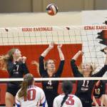 Kenai Centrals Sophie Tapley, Avia Miller and Grace Beiser put up a block against Sitka on Wednesday, Aug. 23, 2023, at Kenai Central High School in Kenai, Alaska. (Photo by Jeff Helminiak/Peninsula Clarion)