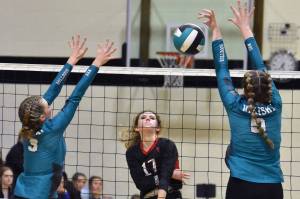Kenai Central's Sophia Tapley attacks against Nikiski's Zoey Ellis and Ashlynne Playle on Saturday, Aug. 26, 2023, at the Shayna Pritchard Memorial Tournament at Nikiski Middle-High School in Nikiski, Alaska. (Photo by Jeff Helminiak/Peninsula Clarion)