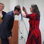Ryan Kimball receives a certified nurse assistant pin from Ana Monyahan at a CNA graduation ceremony at Central Peninsula Hospital in Soldotna, Alaska, on Friday, Aug. 25, 2023. (Jake Dye/Peninsula Clarion)