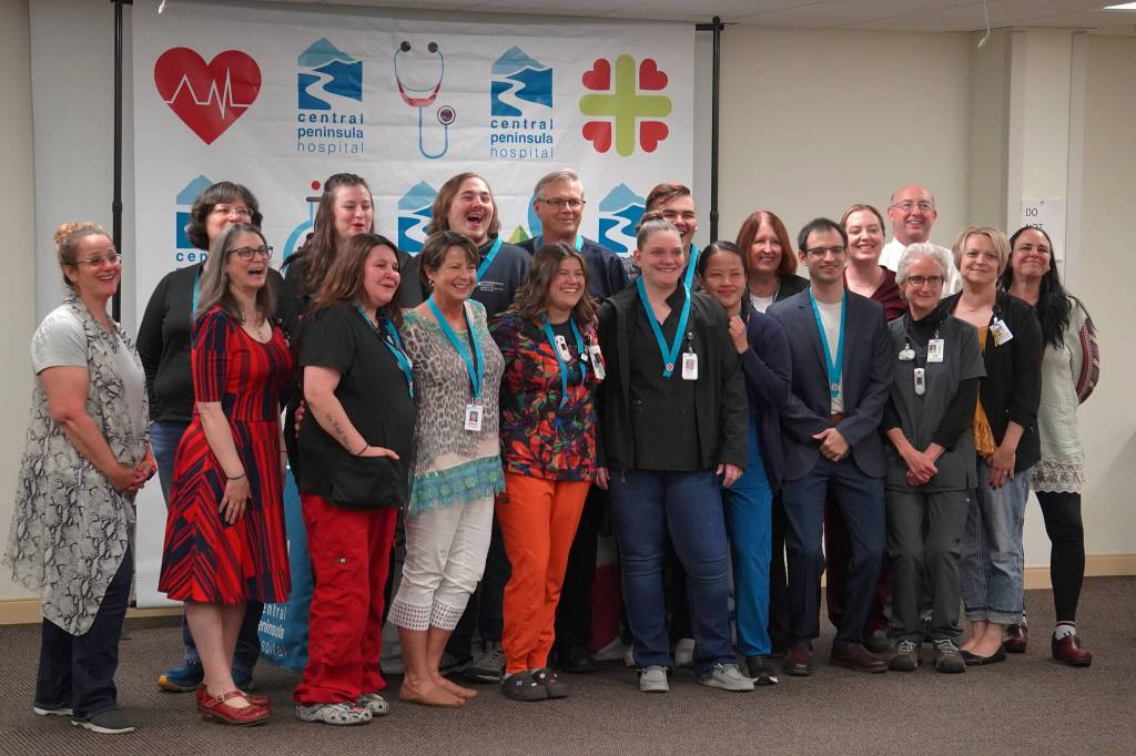 Certified Nurse Assistant program graduates and other hospital staff stand for a photo at Central Peninsula Hospital in Soldotna, Alaska, on Friday, Aug. 25, 2023. (Jake Dye/Peninsula Clarion)