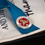 A Certified Nurse Assistant pin is seen at Central Peninsula Hospital in Soldotna, Alaska, on Friday, Aug. 25, 2023. (Jake Dye/Peninsula Clarion)