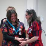 Valerie Villegas receives a certified nurse assistant pin from Ana Monyahan at a CNA graduation ceremony at Central Peninsula Hospital in Soldotna, Alaska, on Friday, Aug. 25, 2023. (Jake Dye/Peninsula Clarion)