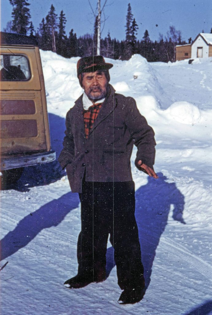 Photo courtesy of the Lancashire Family Collection
[ 1b—] Sergei Pete Peteroff, a Lancashire family neighbor who lived by Eagle Rock on the Kenai River, poses for a photo in the 1950s. The Lancashire vehicle can be seen at left.