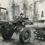 Rusty Lancashire backs up the family tractor so her husband Larry can connect it to the disc for their fields. (1954 photo by Bob and Ira Spring for Better Homes & Garden magazine)