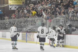 The Kenai River Brown Bears celebrate a second-period goal by Nick Stevens on Friday, April 28, 2023, at the Soldotna Regional Sports Complex in Soldotna, Alaska. (Photo by Jeff Helminiak)