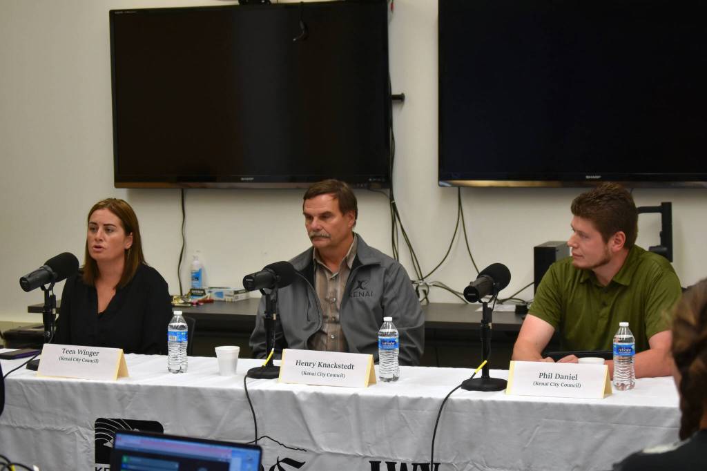 Teea Winger, Henry Knackstedt and Phil Daniel participate in a Kenai City Council candidate forum at the Kenai Community Library in Kenai, Alaska, on Thursday, Sept. 7, 2023. (Jake Dye/Peninsula Clarion)