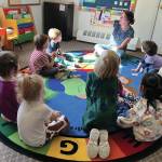 Christy Phillips reads to preschoolers at Seward Sprouts Preschool in Seward, Alaska. (Photo courtesy Seward Sprouts Preschool)
