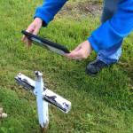 Victoria Askin photographs a gravemarker in the Kenai Cemetery as part of a city imaging project on Friday, Sept. 8, 2023 in Kenai, Alaska. (Ashlyn OHara/Peninsula Clarion)