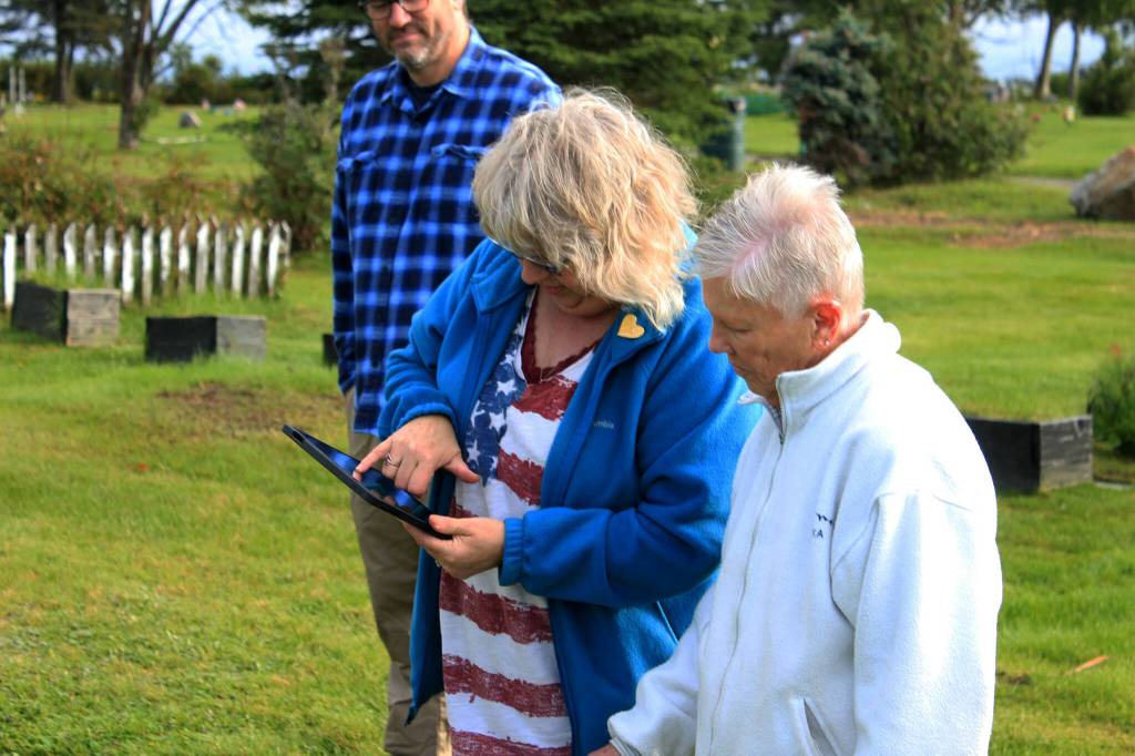 Victoria Askin (left) and Kenai Historical Society President June Harris (right) inspect an interactive map of the Kenai Cemetery as part of a city imaging project on Friday, Sept. 8, 2023, in Kenai, Alaska. (Ashlyn OHara/Peninsula Clarion)