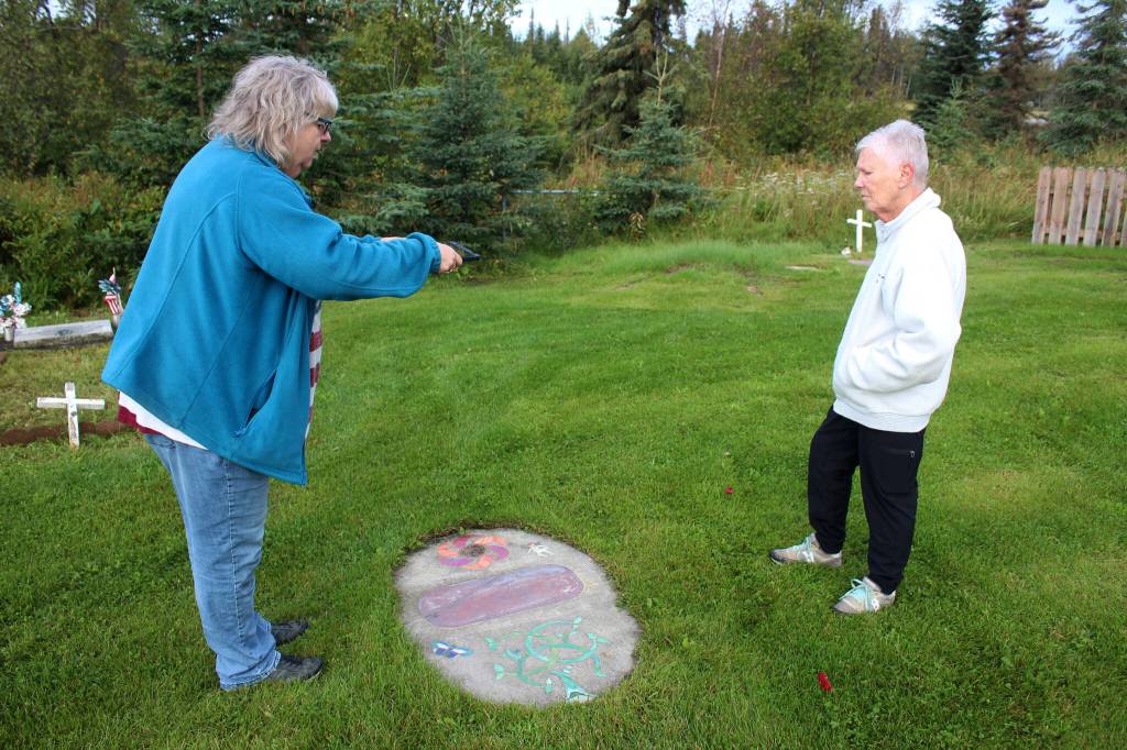 Victoria Askin (left) and Kenai Historical Society President June Harris (right) photograph headstones as part of the City of Kenais cemetery imaging project on Friday, Sept. 8, 2023, in Kenai, Alaska. (Ashlyn OHara/Peninsula Clarion)