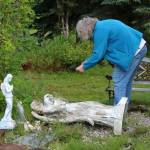 Victoria Askin photographs a headstone in the Kenai Cemetery as part of a city imaging project on Friday, Sept. 8, 2023, in Kenai, Alaska. (Ashlyn OHara/Peninsula Clarion)
