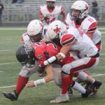 Kenai Centralճ Bobby Hayes leads a tackle of Houston quarterback Carter Seime during a 14-13 loss to Houston on Friday Sept. 8, 2023, in Houston. (Photo by Jeremiah Bartz/Frontiersman)