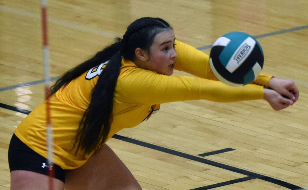 Nikiskis Kailey Stynsberg digs up a ball Thursday, Sept. 14, 2023, against Kenai Central at Nikiski Middle-High School in Nikiski, Alaska. (Photo by Jeff Helminiak/Peninsula Clarion)