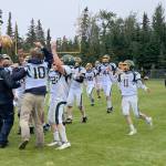 Seward head coach Tyler Mallory presents the Fish Bowl to his team after the Seahawks defeated Nikiski 34-18 on Saturday, Sept. 16, 2023, at Nikiski Middle-High School in Nikiski, Alaska. (Photo by Jeff Helminiak/Peninsula Clarion)