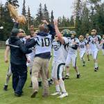 Seward head coach Tyler Mallory presents the Fish Bowl to his team after the Seahawks defeated Nikiski 34-18 on Saturday, Sept. 16, 2023, at Nikiski Middle-High School in Nikiski, Alaska. (Photo by Jeff Helminiak/Peninsula Clarion)