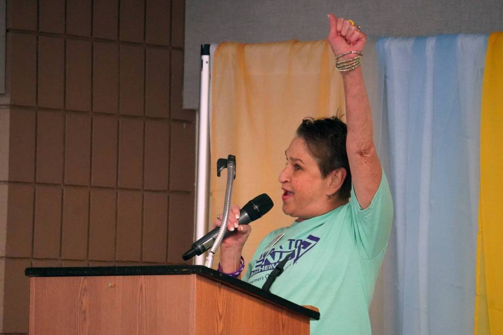 Cindy Harris speaks ahead of the Walk to End Alzheimers at the Soldotna Regional Sports Complex in Soldotna, Alaska, on Saturday, Sept. 16, 2023. (Jake Dye/Peninsula Clarion)