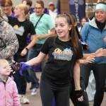Dancers from the Diamond Dance Project perform ahead of the Walk to End Alzheimers at the Soldotna Regional Sports Complex in Soldotna, Alaska, on Saturday, Sept. 16, 2023. (Jake Dye/Peninsula Clarion)