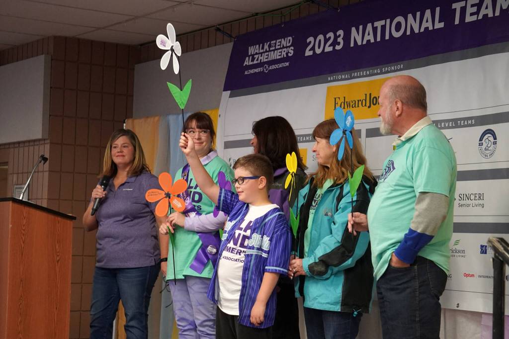 A promise garden flower ceremony is held for the Walk to End Alzheimers at the Soldotna Regional Sports Complex in Soldotna, Alaska, on Saturday, Sept. 16, 2023. (Jake Dye/Peninsula Clarion)