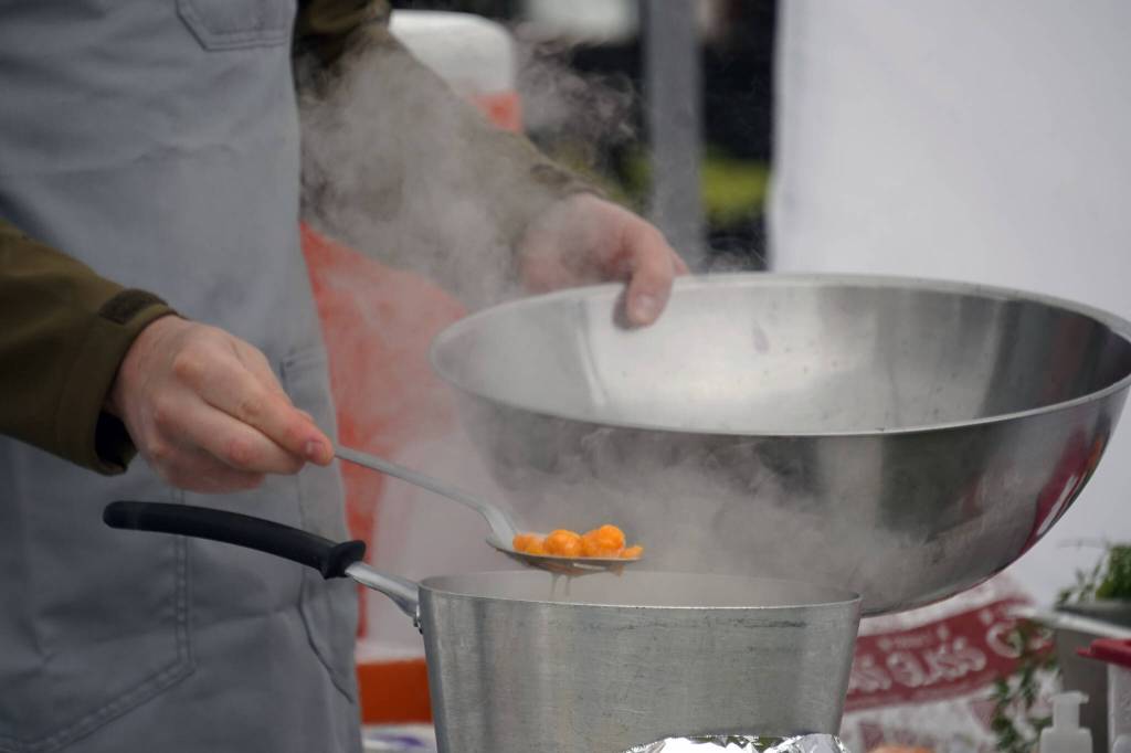 Andrew Agosti prepares carrot gnocchi at the Harvest Moon Local Food Festivals Chef Tent at Soldotna Creek Park in Soldotna, Alaska, on Saturday, Sept. 16, 2023. (Jake Dye/Peninsula Clarion)