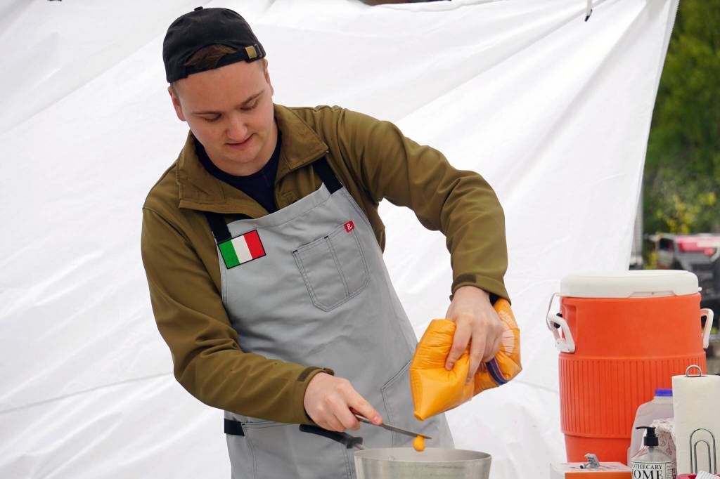 Andrew Agosti prepares carrot gnocchi at the Harvest Moon Local Food Festivals Chef Tent at Soldotna Creek Park in Soldotna, Alaska, on Saturday, Sept. 16, 2023. (Jake Dye/Peninsula Clarion)