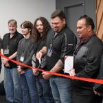 Andrew Farina prepares to cut the ribbon at the grand opening of Victra in Soldotna, Alaska, on Friday, Sept. 15, 2023. (Jake Dye/Peninsula Clarion)