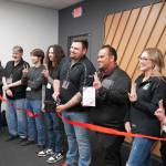 A ribbon is cut at the grand opening of the Victra in Soldotna, Alaska, on Friday, Sept. 15, 2023. (Jake Dye/Peninsula Clarion)