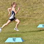 Soldotnas Tania Boonstra sprints to victory in the Kenai Peninsula Borough girls race Thursday, Sept. 21, 2023, at Tsalteshi Trails just outside of Soldotna, Alaska. (Photo by Jeff Helminiak/Peninsula Clarion)