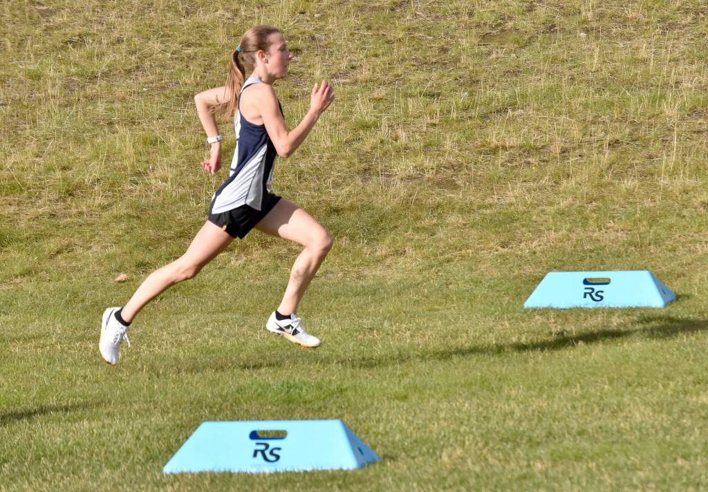 Soldotnas Tania Boonstra sprints to victory in the Kenai Peninsula Borough girls race Thursday, Sept. 21, 2023, at Tsalteshi Trails just outside of Soldotna, Alaska. (Photo by Jeff Helminiak/Peninsula Clarion)