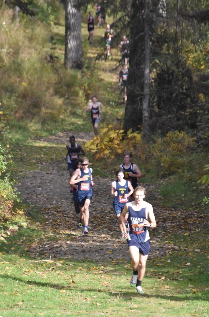 Soldotnas Noble Cassidy leads runners through the last kilometer of the Kenai Peninsula Borough boys varsity race Thursday, Sept. 21, 2023, at Tsalteshi Trails just outside of Soldotna, Alaska. (Photo by Jeff Helminiak/Peninsula Clarion)
