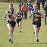 Homers Beatrix McDonough and Sewards Juniper Ingalls sprint to the finish of the Kenai Peninsula Borough girls varsity race Thursday, Sept. 21, 2023, at Tsalteshi Trails just outside of Soldotna, Alaska. (Photo by Jeff Helminiak/Peninsula Clarion)