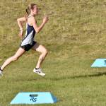Soldotna's Tania Boonstra sprints to victory in the Kenai Peninsula Borough girls race Thursday, Sept. 21, 2023, at Tsalteshi Trails just outside of Soldotna, Alaska. (Photo by Jeff Helminiak/Peninsula Clarion)