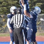Soldotnas Hokoa Montoya hoists up Gehret Medcoff after a touchdown against Chugiak on Friday, Sept. 22, 2023, at Justin Maile Field at Soldotna High School in Soldotna, Alaska. (Photo by Jeff Helminiak/Peninsula Clarion)